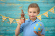 © Jacek - A young boy and decorations for Easter. Studio background.