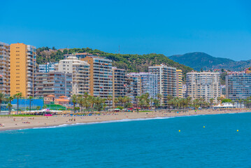 Canvas Print - People are enjoying a sunny day on Malagueta beach in Malaga, Spain.