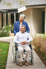 Poster - Out for a stroll. Shot of a senior woman pushing her husband in a wheelchair outside.