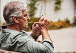 © Tinashe Njaku/peopleimages.com - Time to light up. Cropped shot of a relaxed senior man smoking a marijuana joint on his own inside of his garden at home during the day.