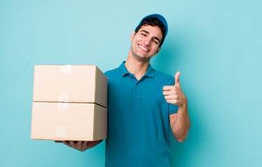 handsome hispanic man feeling proud,smiling positively with thumbs up. employee concept