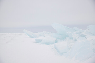 picturesque ice hummock on winter lake baikal. beautiful winter landscape with ice and snow. horizon
