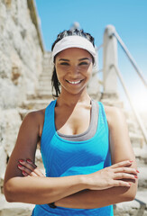 Wall Mural - I know I can do it. Portrait of a young sporty woman standing outside.