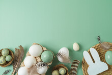 Easter Holiday Concept With White Eggs And Decoration On Green Background. Top View, Flat Lay