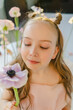 © Westend61 - Cute girl holding fresh flower in hand