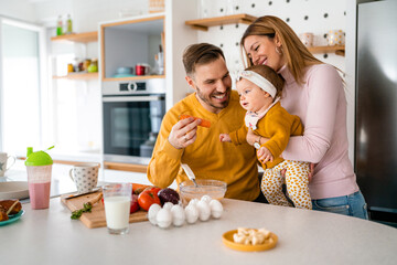 Wall Mural - Happy family with children playing and cuddling at home