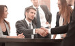 © ASDF - Handshake between employees after the meeting