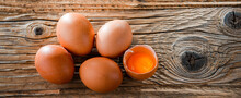 Composition With Five Chicken Eggs On A Wooden Table