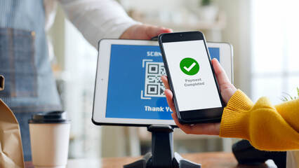 QR code payment, customer using smartphone for paying at shop