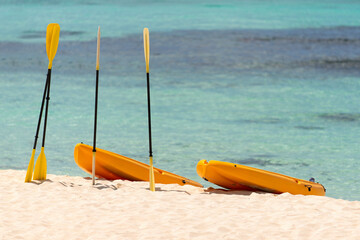 Wall Mural -  Orange boats with oars on the sandy shore. Beautiful seascape on the Caribbean Sea in the Dominican Republic