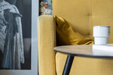Fototapeta  - Detal na przytulny salon z żółtymi akcentami kolorystycznymi.
