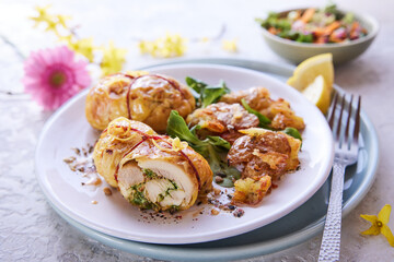 Canvas Print - Tasty filled chicken thighs on plate with greenery