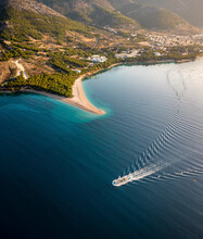 Aerial View Of A Passenger Boat Sailing Near The Coastline In Split, Dalmatia, Croatia.