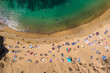 © AmazingAerialAgency - Aerial view of people on the beach at Playa del Papagayo (Papagayo Beach) near Playa Blanca, Lanzarote, Canary Islands, Spain.