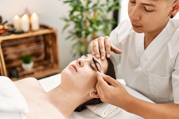 Wall Mural - Woman reciving eyebrows treatment at beauty center.