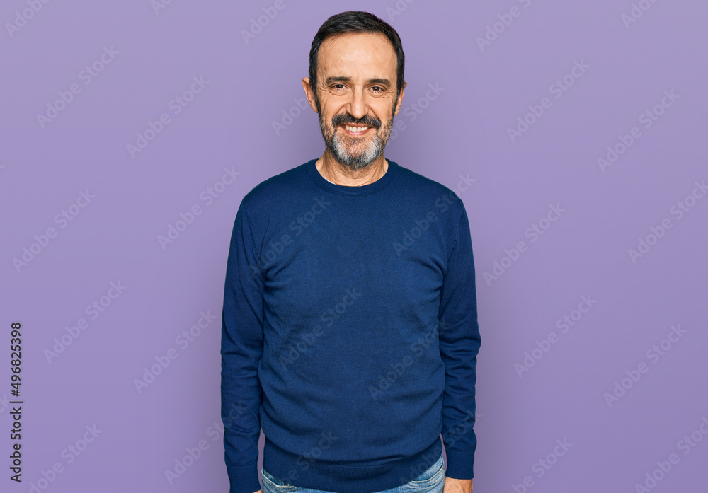 Middle age hispanic man wearing casual clothes with a happy and cool smile on face. lucky person.