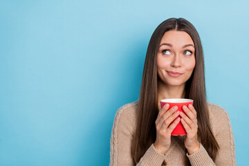 Wall Mural - Portrait of attractive pensive sly cheery girl drinking latte thinking copy blank space isolated over bright blue color background