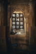 Vertical shot of an interior window of a building with a gothic architectural style