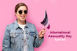 International Asexuality Day. Happy girl hold asexual flag, on pink background.
