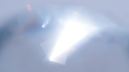 Wall Mural - Sun Flare Inside a Diamond. Loop. The light passes through the facets of a slowly rotating diamond and creates repetitive sparkling highlights and rainbow colors