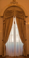 Antique window with beautiful elegant curtains