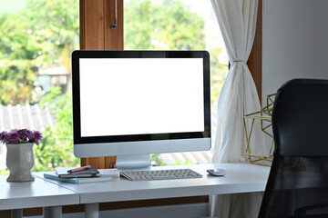 Poster - Front view computer with blank white screen in the office, for business and technology concept.