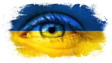 War in Ukraine background - Close-up of child's eyes with tears, in the colors of Ukrainian flag, isolated on white paintbrush brushstroke texture background
