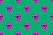 Purple skulls on green background. Seamless repeating pattern. Digital collage.