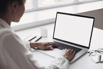 Young woman using laptop computer at home. Business woman working in office. Freelance, student lifestyle, e-learning, studying, web site, technology and online shopping concept