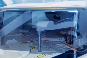 Wall Mural - scientist working with auto robotical machine for testing blood, modern laboratory medical equipment