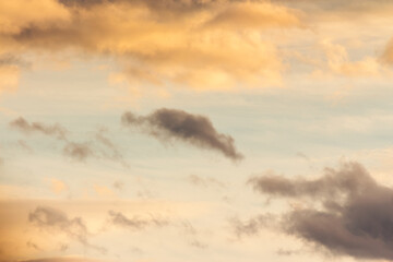 Wall Mural - clouds on the sky in golden hour light. warm weather in summer at sunset