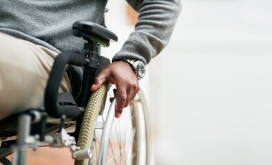 Wall Mural - He can still get around. Cropped shot of an unrecognizable senior man sitting in his wheelchair at home.