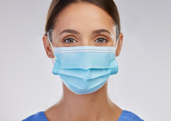 Poster - Im here to help. Shot of a young female nurse against a studio background.