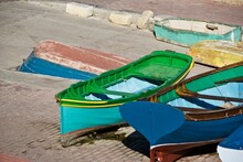 Richly Colored Boats For Fishing In A Small Harbor On The Island Malta.