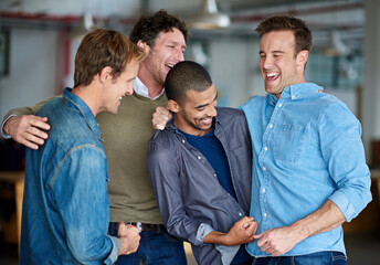 Leinwandbilder - Boys will be boys. Male colleagues joking with each other in the office.