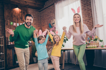 Poster - Portrait of four excited overjoyed people have fun hold arms wear bunny rabbit ears house indoors