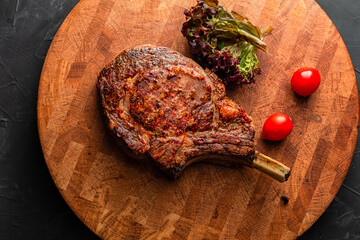 Wall Mural - Juicy medium rare beef steak with vegetables on wooden board, traditional american cuisine,grill and barbeque.