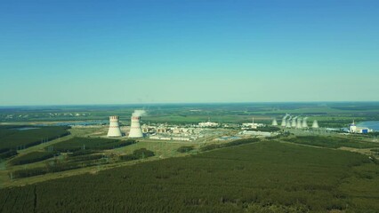 Wall Mural - Nuclear power plant, Cooling tower of Atomic power stations with emission of steam in the air atmosphere. Industrial zone .