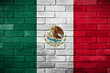México. Flaga Meksyku namalowana na ceglanym murze. The Mexican flag painted on a brick wall.