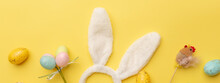 Bunny Rabbit Ears And Easter Decor On Yellow Background. Easter Minimal Concept. Flat Lay