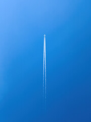 passenger airplane in flight in clear blue sky