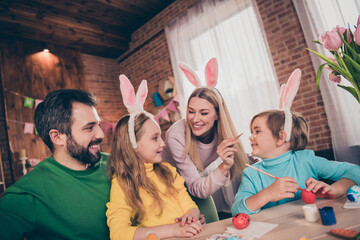 Poster - Portrait of beautiful handsome cheerful family preparing party drawing eggs having fun good mood rest art indoors