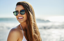 Summer Is A State Of Mind. Closeup Shot Of A Beautiful Young Woman Spending Some Time At The Beach.