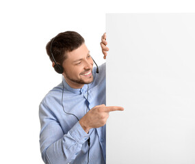 Poster - Consultant of call center in headset pointing at blank paper sheet on white background