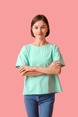 Wall Mural - Beautiful young woman in stylish t-shirt on color background