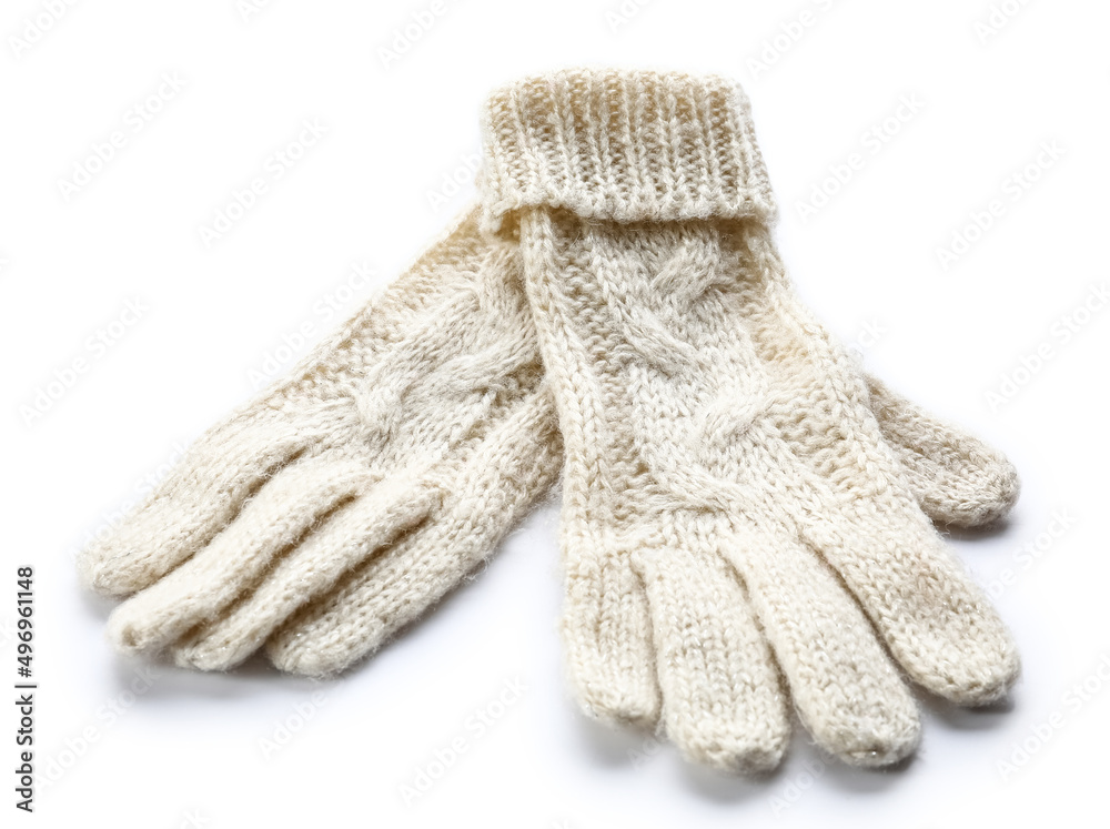 Knitted warm gloves on white background
