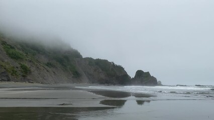 Wall Mural - empty tranquil calm seaside waves morning foggy shoreline ocean wave tide pool video