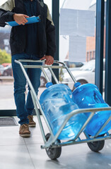 Poster - Bottled and delivered straight to your door. Cropped shot of a courier making a bottled water delivery in an office.