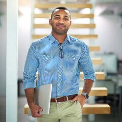 Poster - I take my work with me. Cropped portrait of a handsome young businessman carrying his laptop in the office.