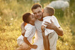 © prostooleh - Cute family playing in a summer field